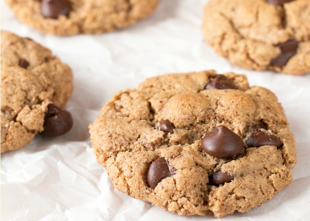 Up close picture of almond butter chocolate chip cookies on waxed paper