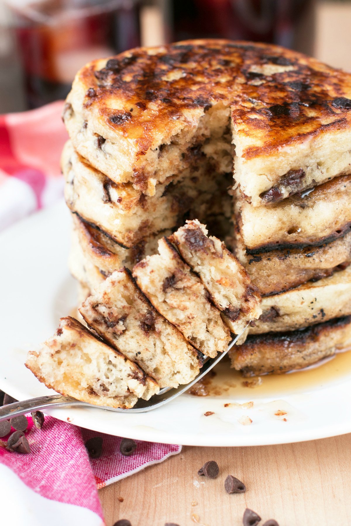 Stack of chocolate chip pancakes with a bite taken from them