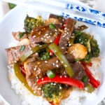 The combination of tender beef, fresh vegetables, and a rich garlic stir fry sauce
