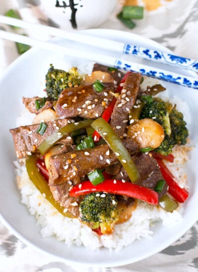 The combination of tender beef, fresh vegetables, and a rich garlic stir fry sauce