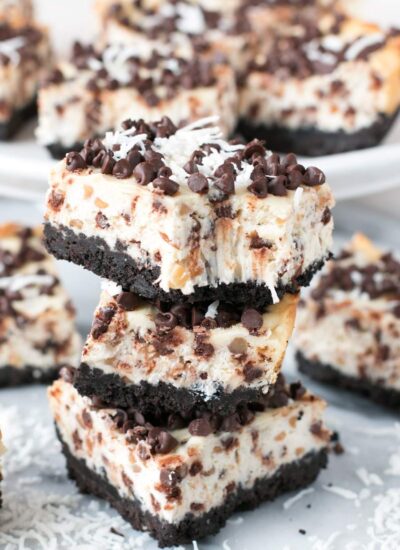 Chocolate graham cracker crust and a cheesecake filled with chopped almonds, coconut