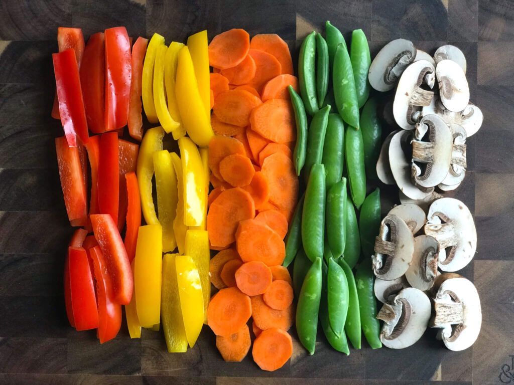 ingredients - peppers, carrots, peas, mushrooms