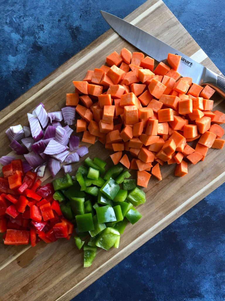sweet potato hash ingredients - peppers, onion, and sweet potatoes