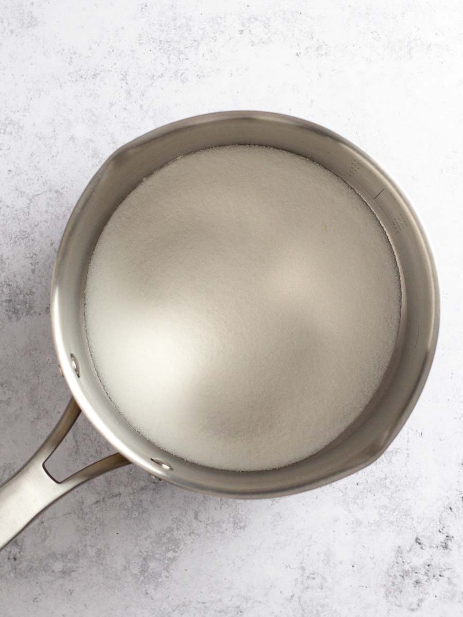 A saucepan with sugar.