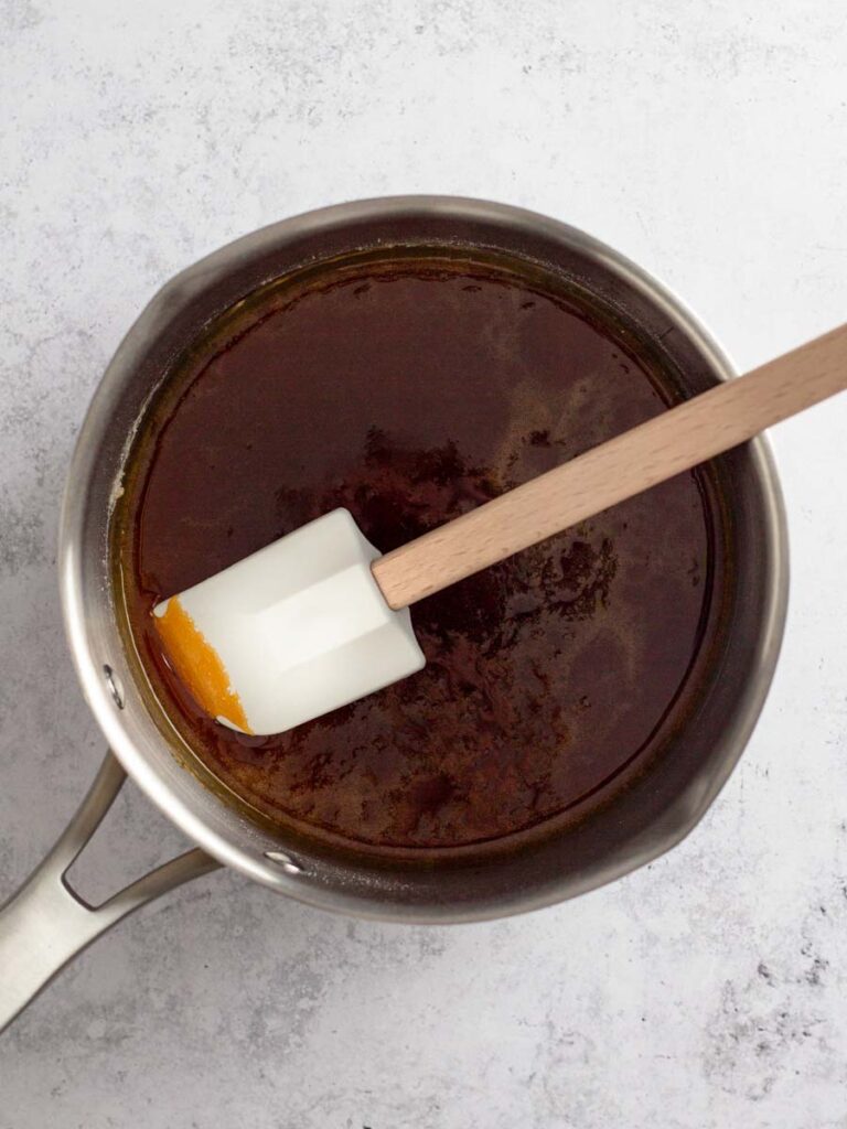 Caramelizing sugar inside of a saucepan.