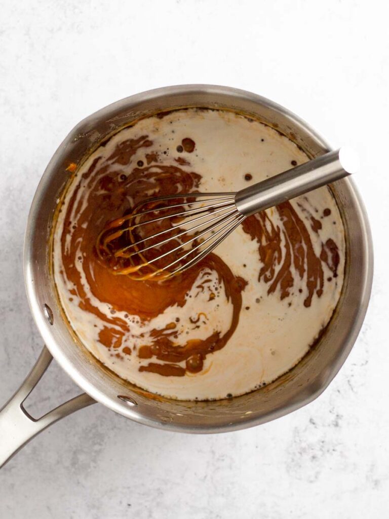 Whisking caramel sauce.