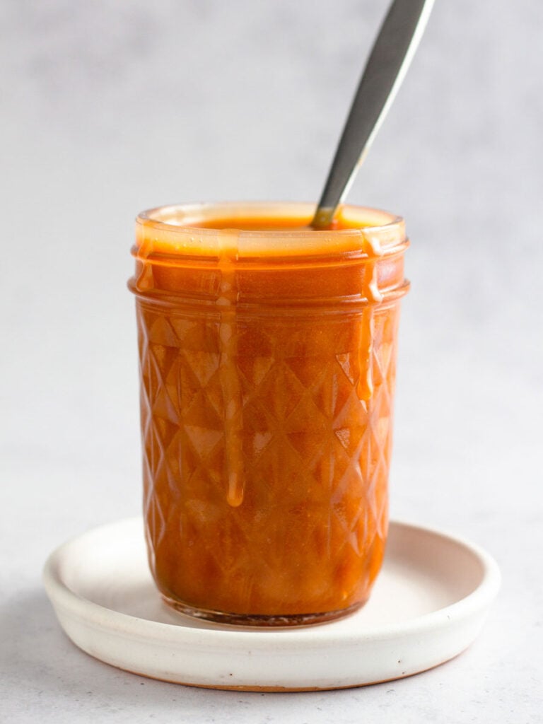 Caramel sauce in a mason jar.