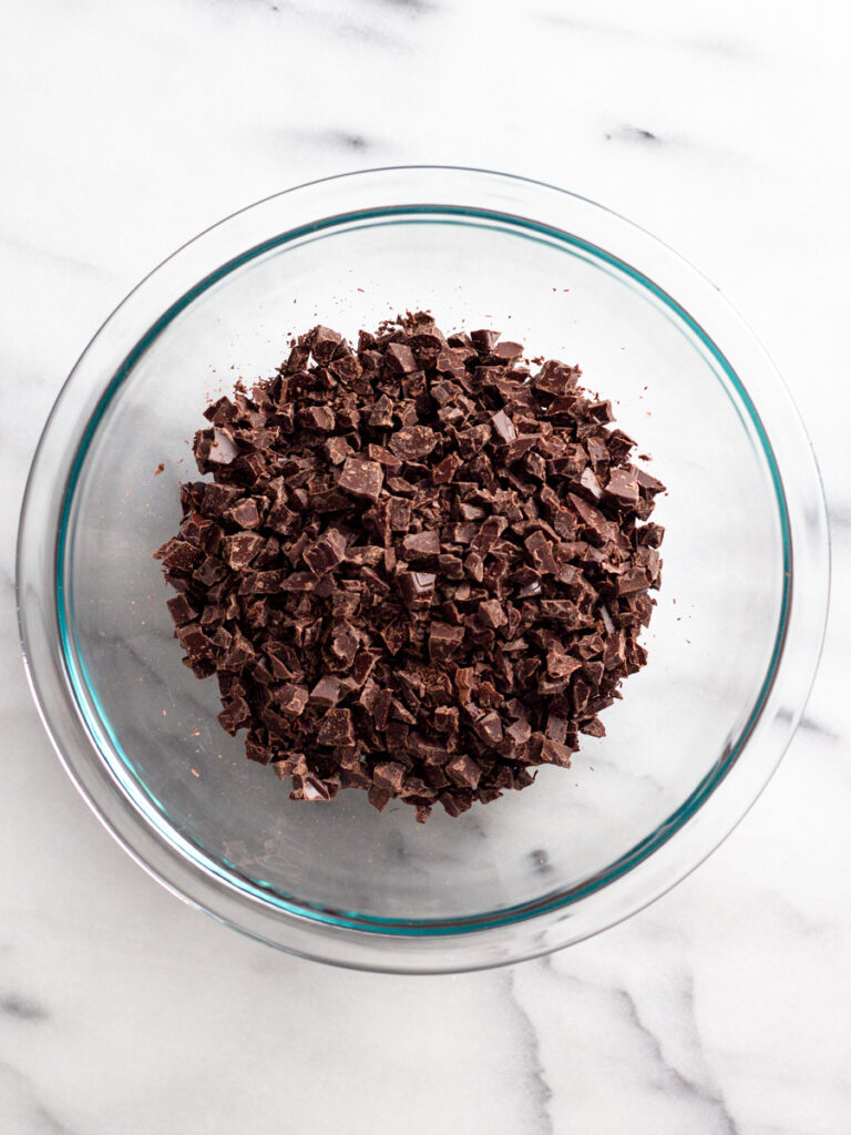Chopped chocolate in a bowl.