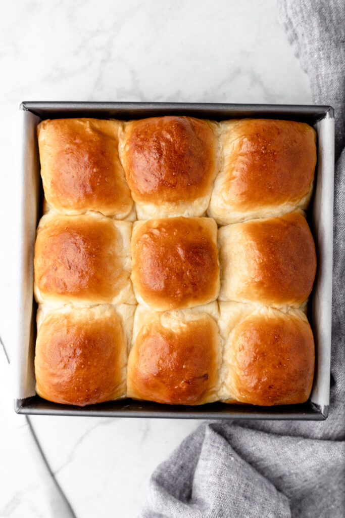 Baked sweet rolls inside of a tray.