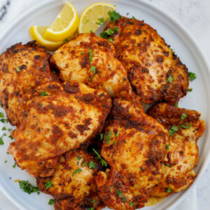 Overhead shot of air fryer boneless chicken thighs on a plate.