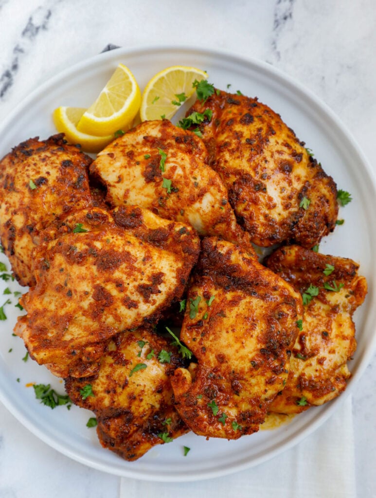 Overhead shot of air fryer boneless chicken thighs on a plate.