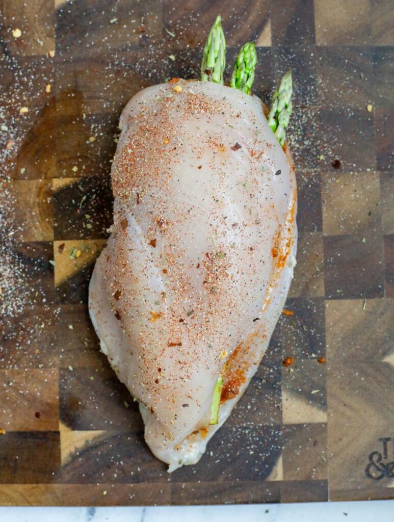 Raw, stuffed chicken breast.