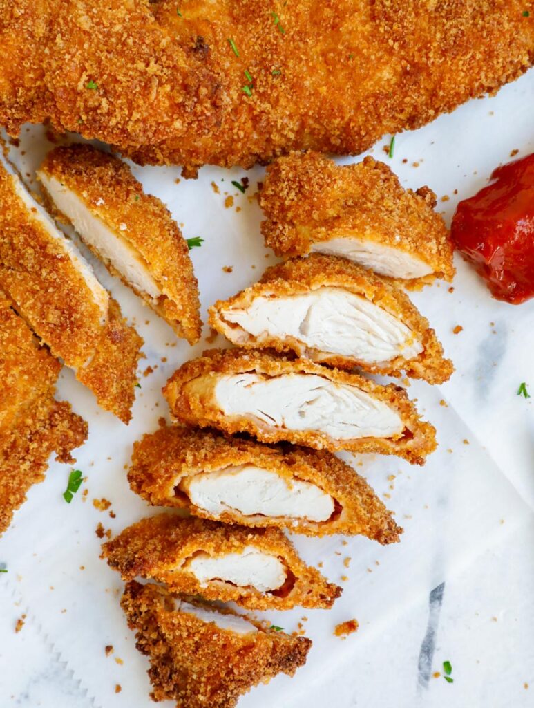 chicken tenders sliced to show the inside flesh