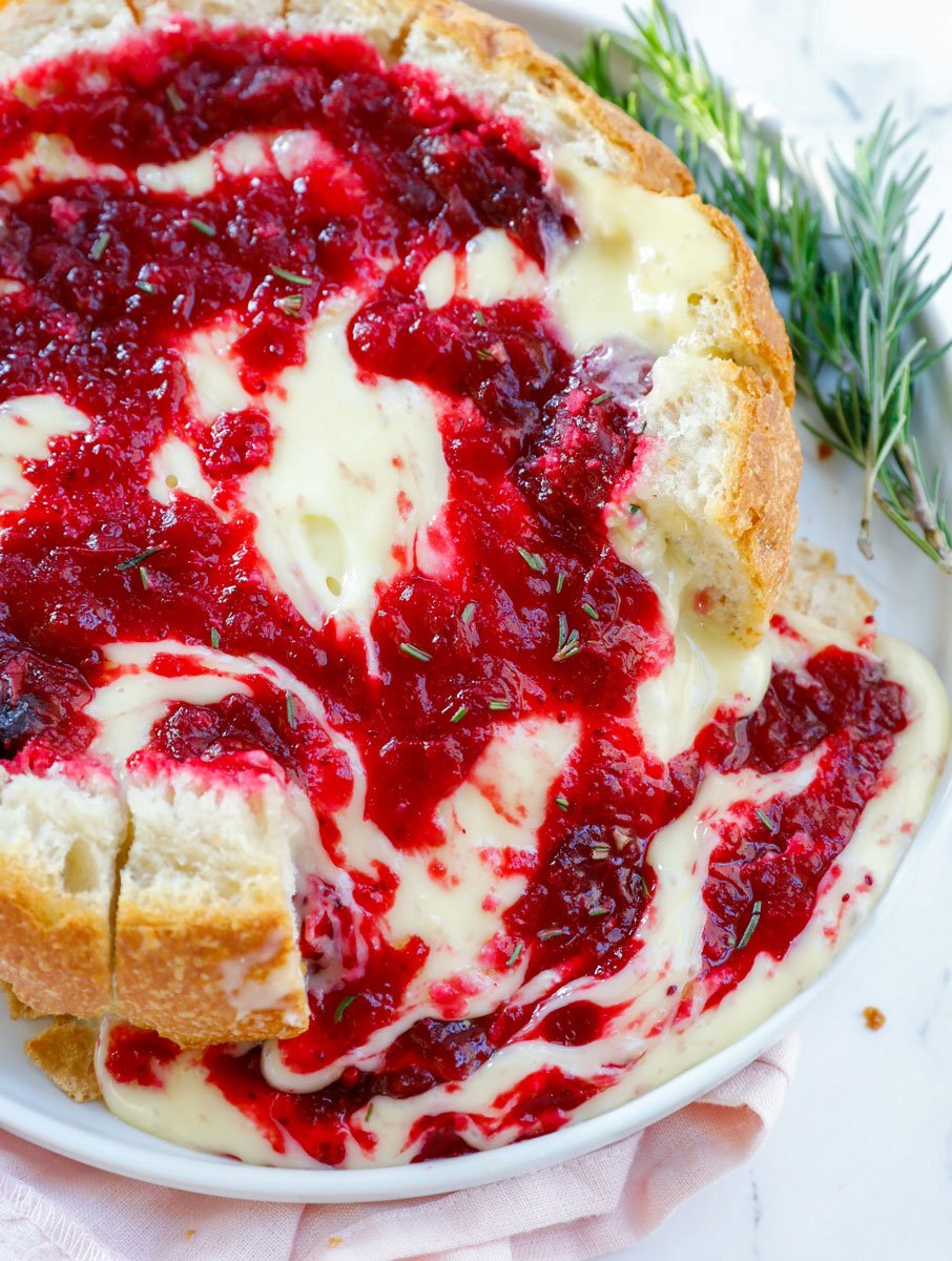 Top down shot of baked brie cranberry bread bowl.