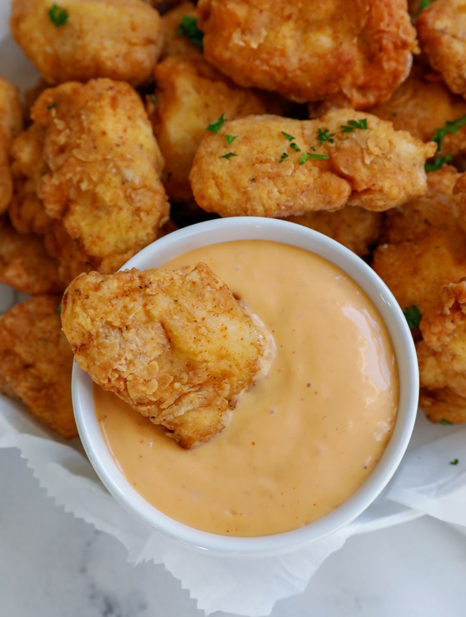 homemade chicken nuggets dipped in sauce
