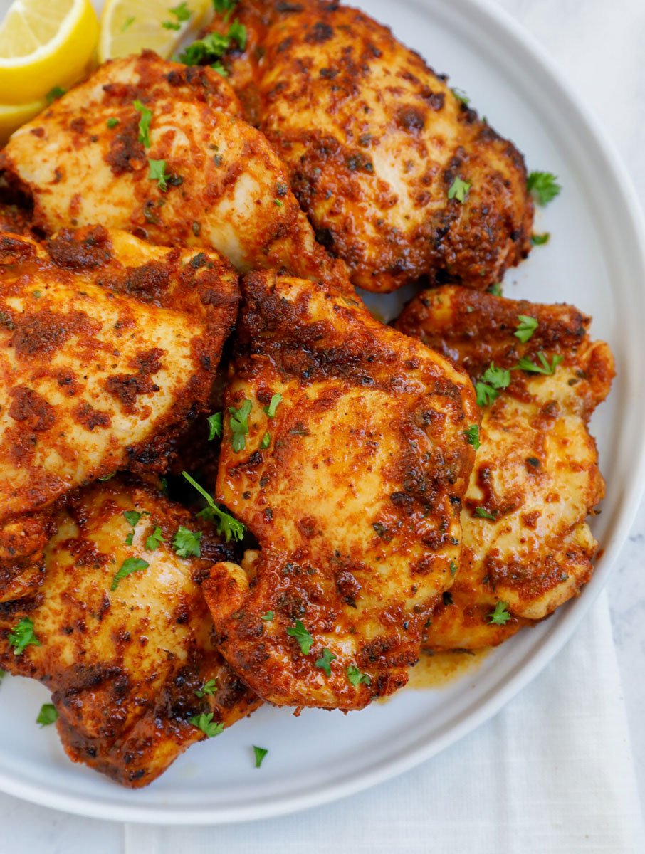 Overhead shot of air fryer chicken thighs. 