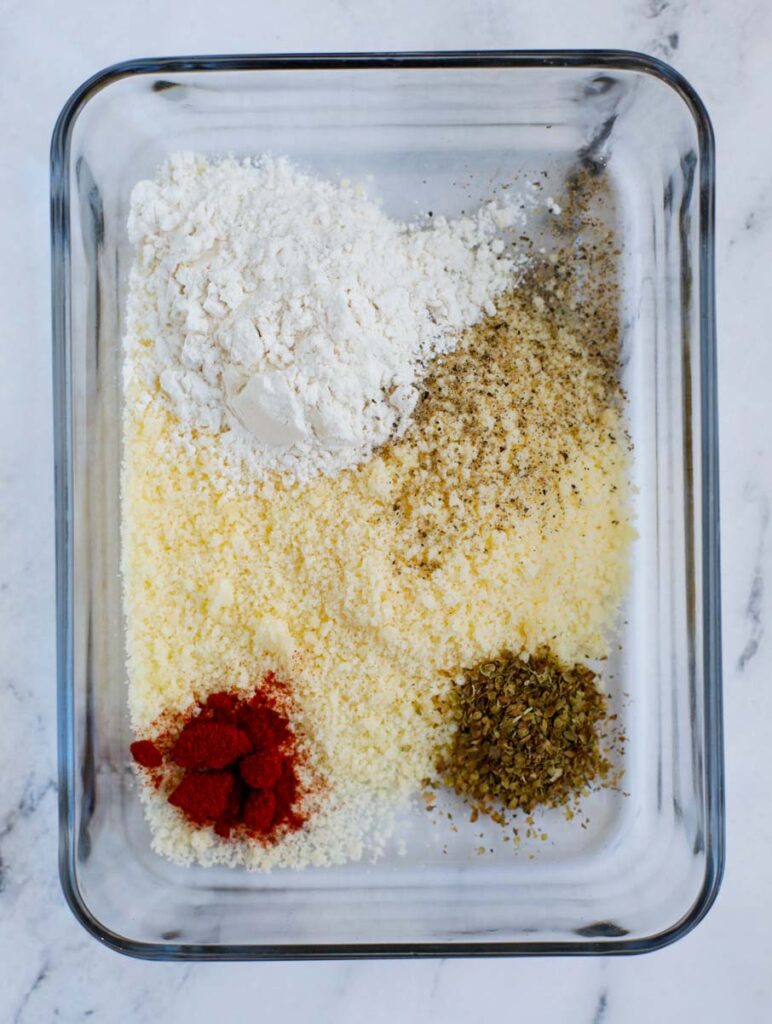 Seasoning and flour in a container.