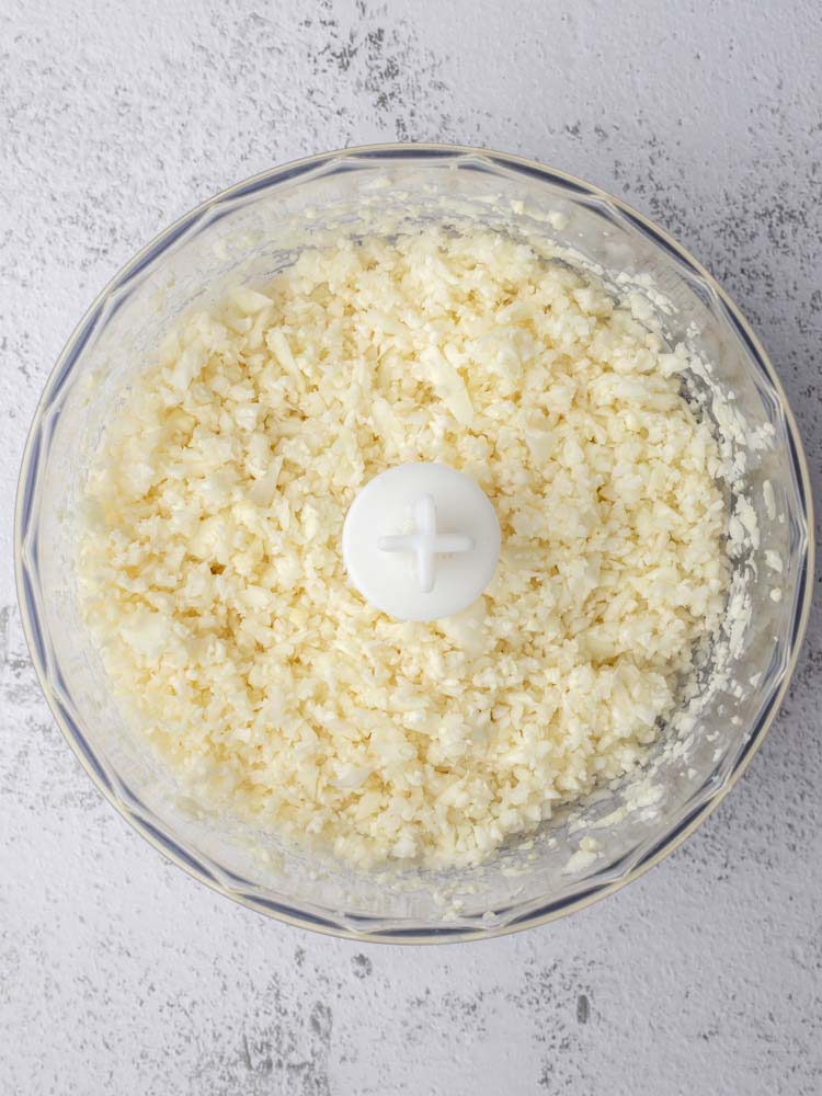 grated cauliflower in a food processor