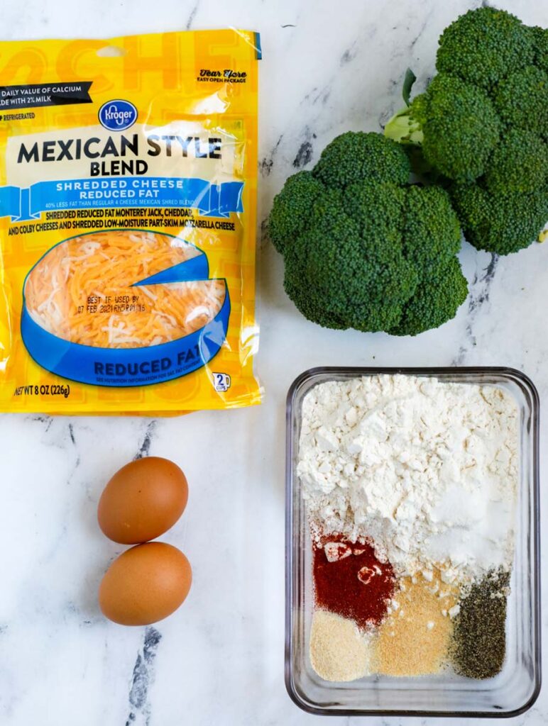 Overhead shot of ingredients for cheesy broccoli bites.