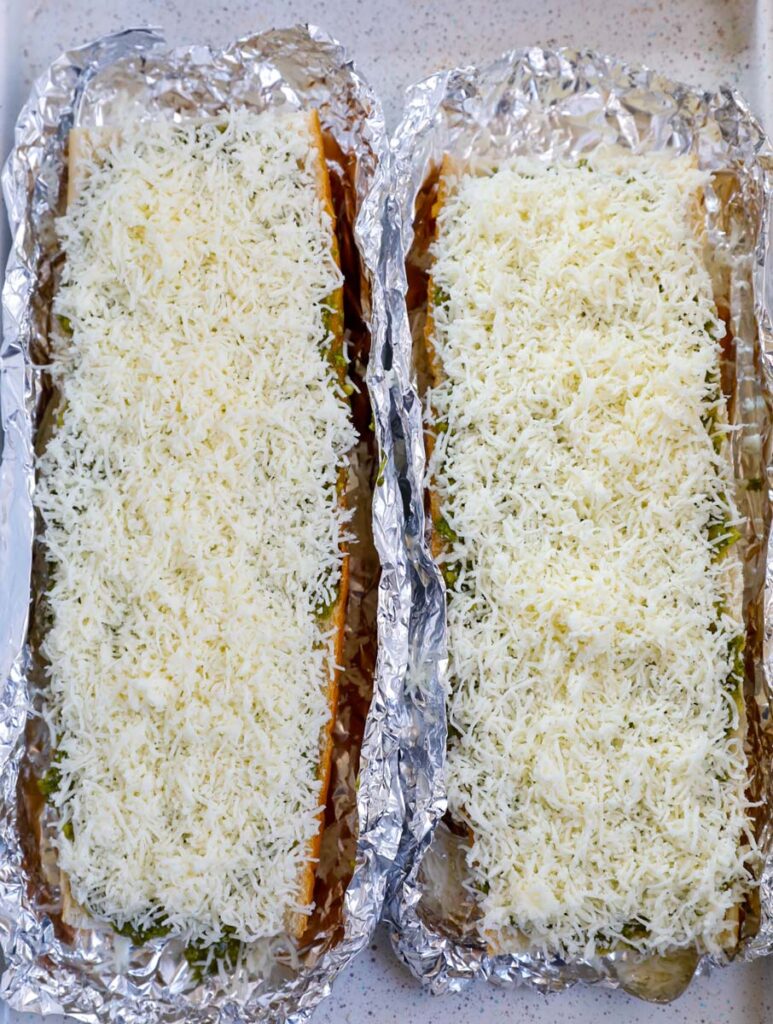 Overhead shot of bread slices with cheese on top. 