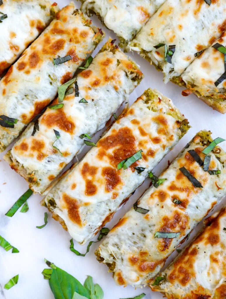 Top down shot of slices of cheesy bread.