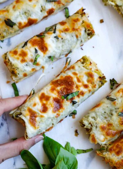 Top down shot of slice being pulled out of the cheesy bread.