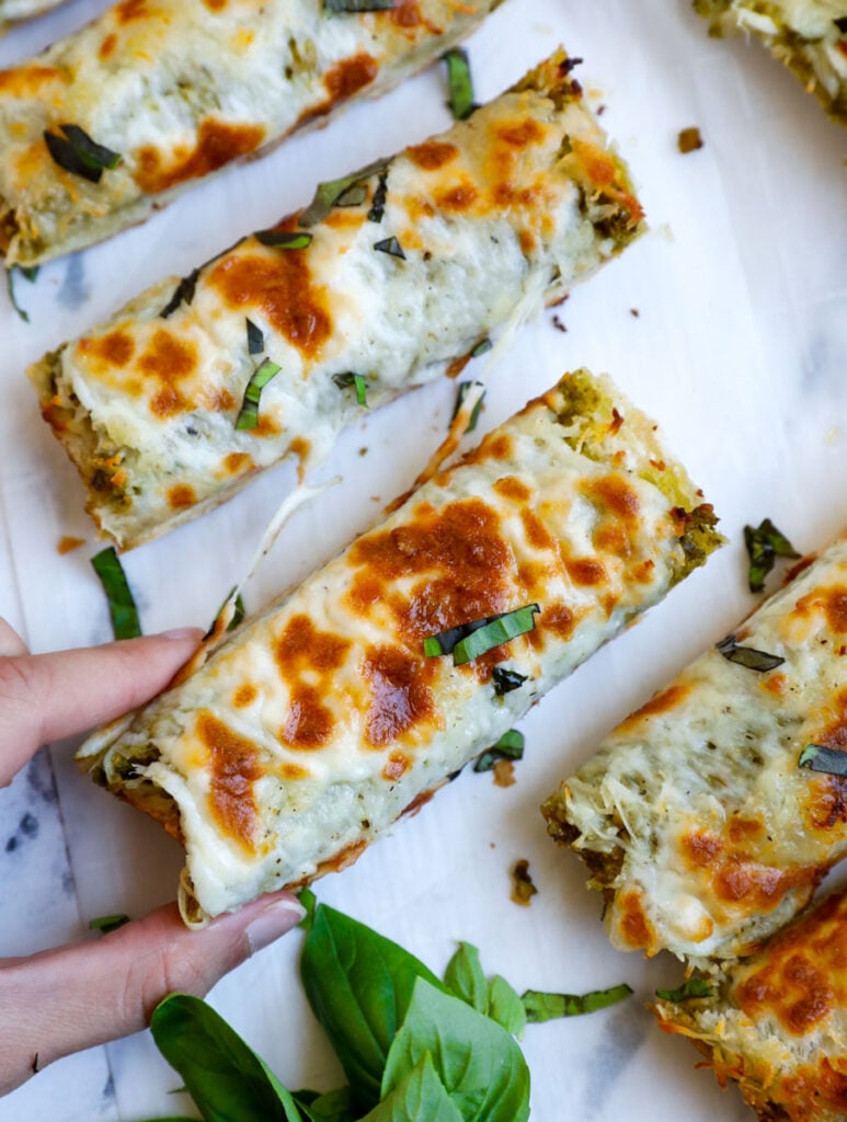 Top down shot of slice being pulled out of the cheesy bread.