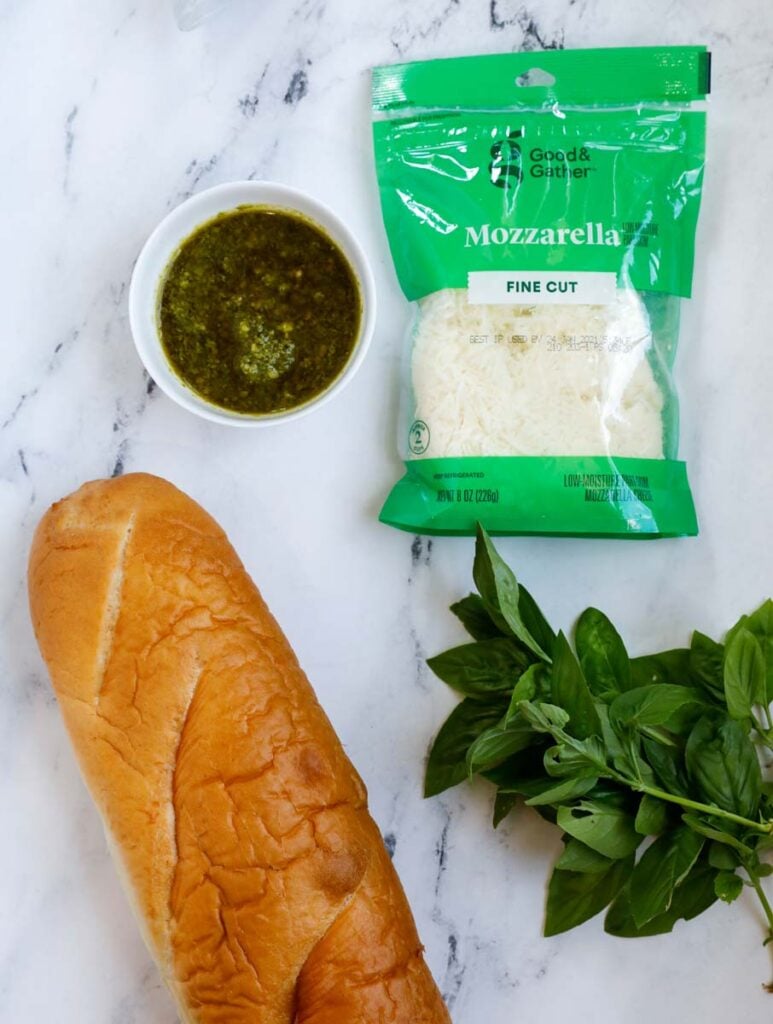 Top down shot of cheesy pesto bread sticks. 