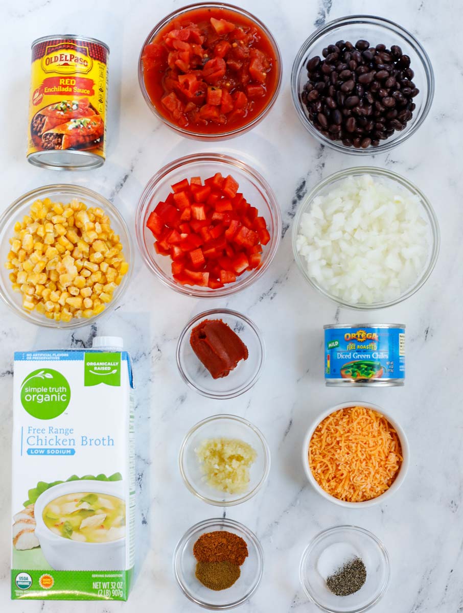 Top down view of ingredients needed to make chicken enchilada soup.