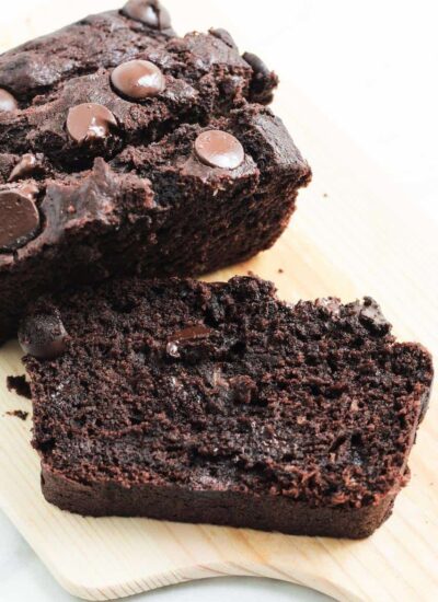 slice of chocolate banana cake on a wooden board