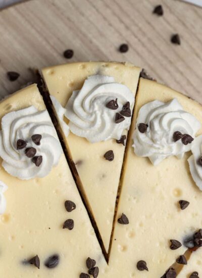 top down view of chocolate chip cheesecake with a slice cut out