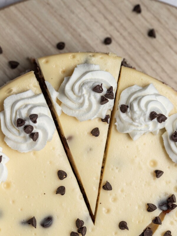 top down view of chocolate chip cheesecake with a slice cut out