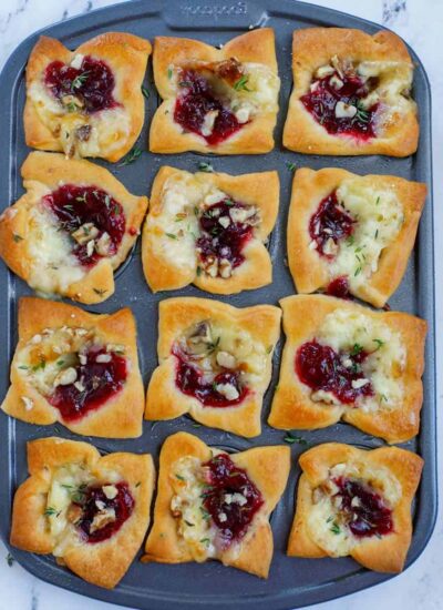 Top down shot of cranberry brie bites in a pan.