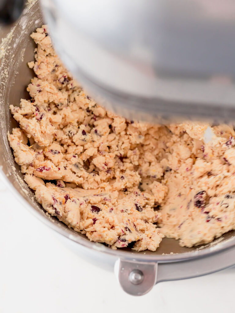 Top down shot of dough in a mixer. 