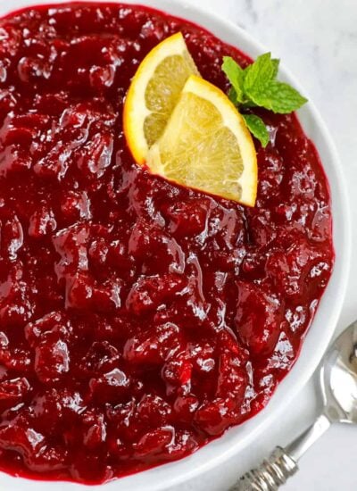 close up shot of cranberry sauce served in a while dish
