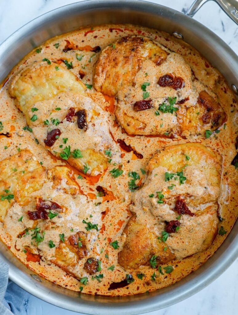 Creamy cajun chicken in a skillet.