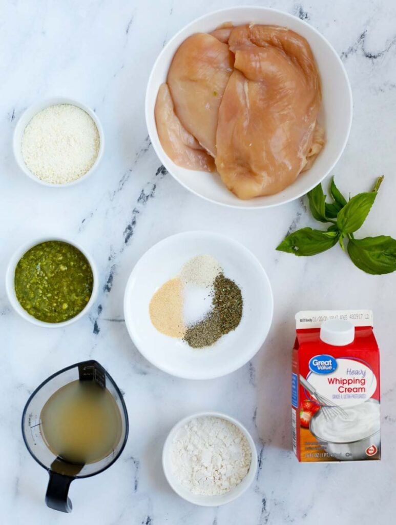Top down shot of ingredients for creamy pesto chicken.