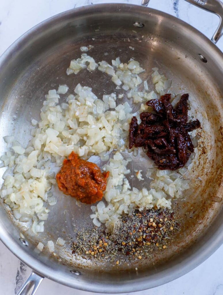 Garlic and spices in a skillet.