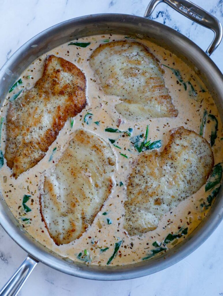 Chicken in a pot with cream.