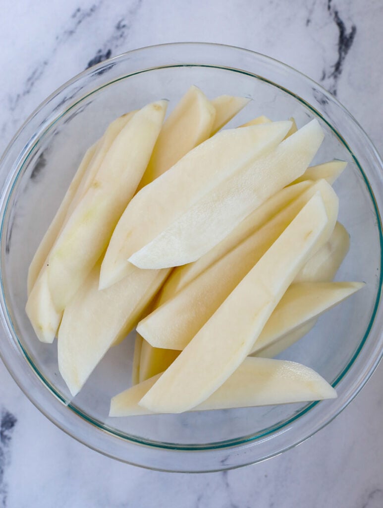 Potato slices in a bowl.