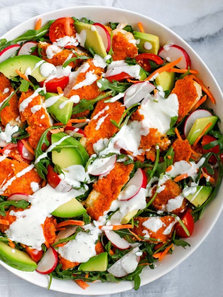 Overhead shot of chicken salad in a white bowl.