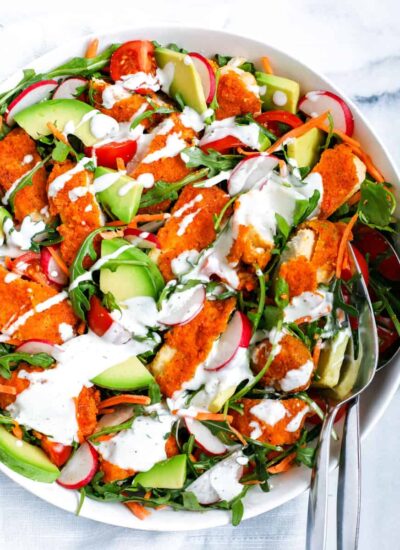 Top down shot of chicken salad in a white bowl.