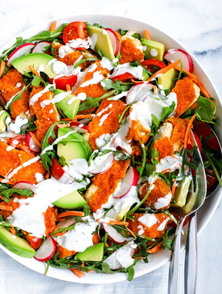 Top down shot of chicken salad in a white bowl.