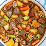 Top down view of best beef stew in a blue pot.