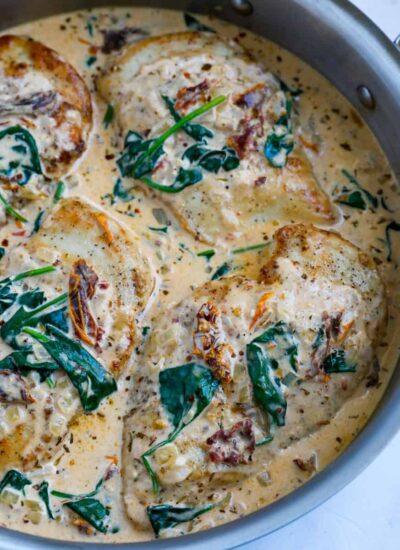 Top down shot of tuscan chicken in a pot.