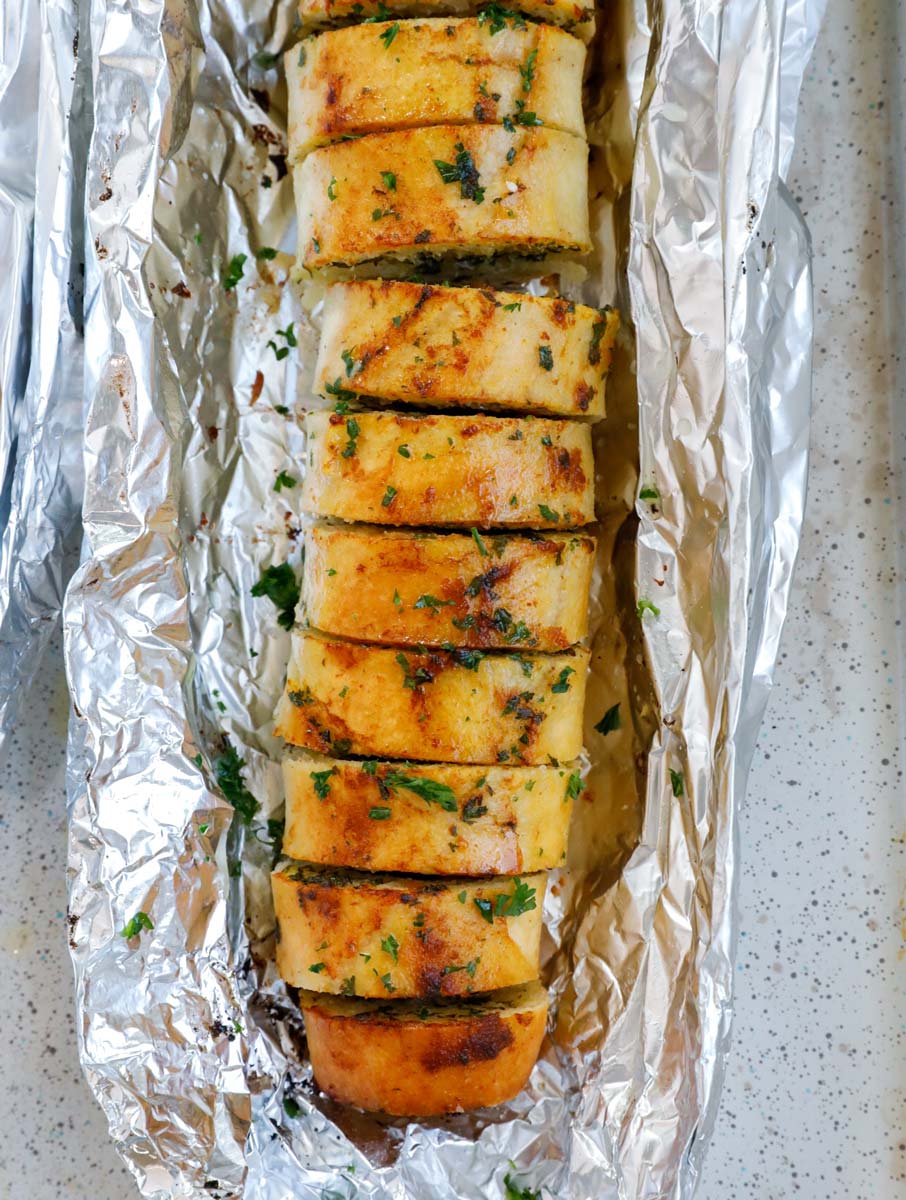 Top down view of easy garlic bread in foil.