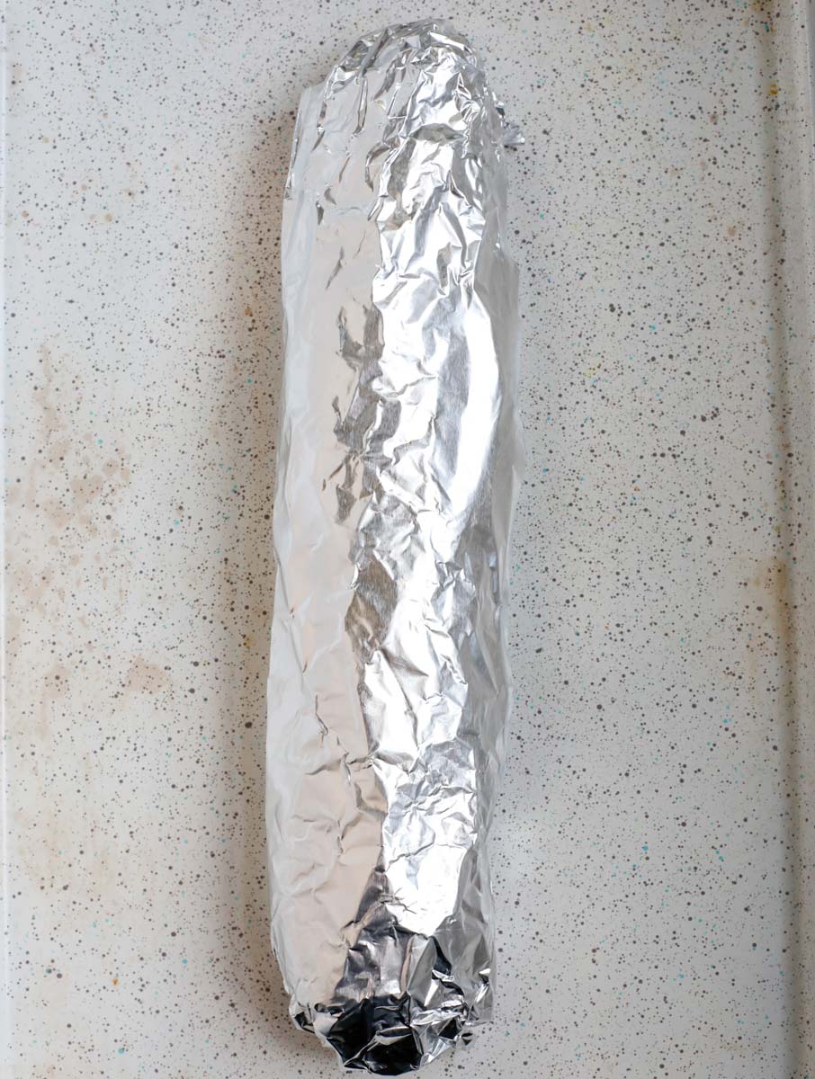 bread wrapped in foil to bake