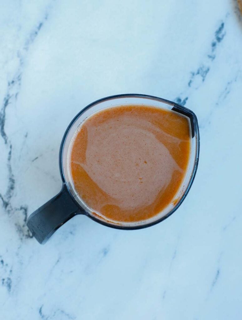 general tso's sauce mixed in a measuring cup.