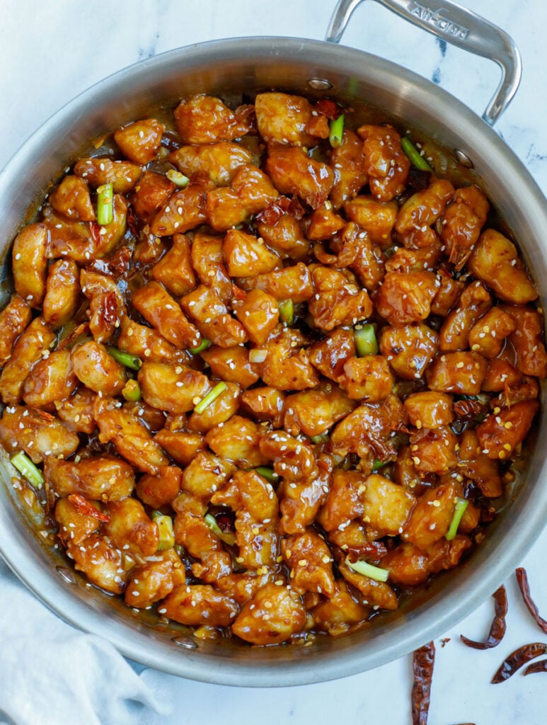 Overhead photo of saucy general tso chicken in a skillet.