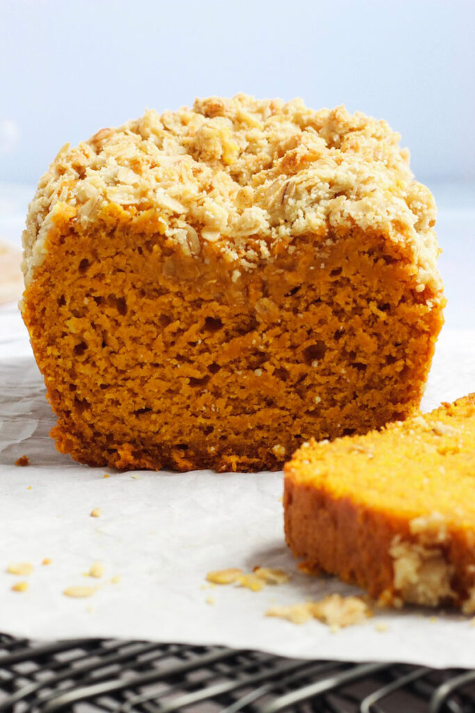 Close up of sliced easy pumpkin bread on a table. 